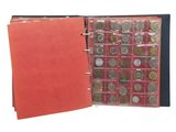 a red folder with a bunch of coins inside of it