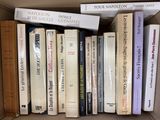 many books that are in a box on the table