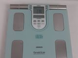 a bathroom scale with a digital display on it