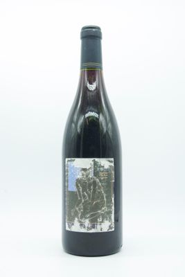 a bottle of wine that is sitting on a table