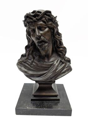 a bronze bust of jesus with a crown of thorns on his head