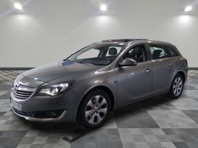 a picture of a grey opel parked in a garage