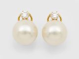 a pair of pearl and diamond earrings
