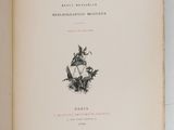 an open book on a white surface with a drawing of a cat