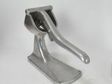 a metal object that is sitting on a white surface