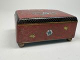 an image of a red and black box sitting on top of a table