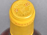 a close up of a bottle of liquor on a table