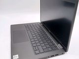 a laptop computer sitting on a table with a keyboard