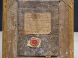 an old picture of a piece of paper with a wax seal on it