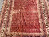 an old rug is laying on the ground on the ground