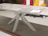 a white table with a marble top in a room