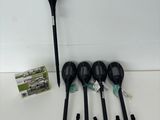 four black plastic spoons and four black plastic spoons on a white surface
