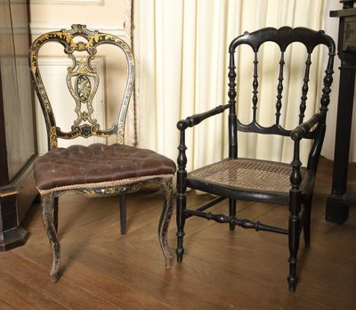 two chairs sitting next to each other on a hard wood floor