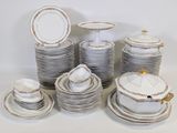 a lot of plates and cups and saucers on the table