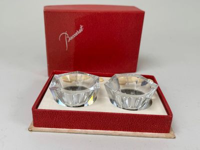 pair of crystal candle holders in a red box on a white surface