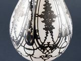 a white vase with a black and white design on it
