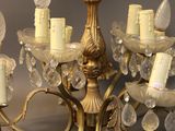 a chandelier that has a lot of candles on it