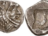 a silver coin with an image of a woman on it