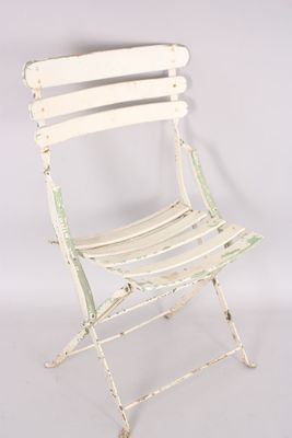 white metal folding chair against a white background