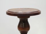 a small wooden table with a wooden top on a white background