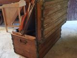 a wooden box with a bunch of items inside of it