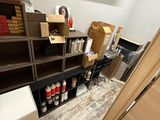 a room that has a lot of boxes and boxes on the shelves