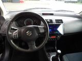 dashboard view of a car with a steering wheel and dashboard controls