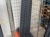 a metal cart that has several pieces of metal on top of it