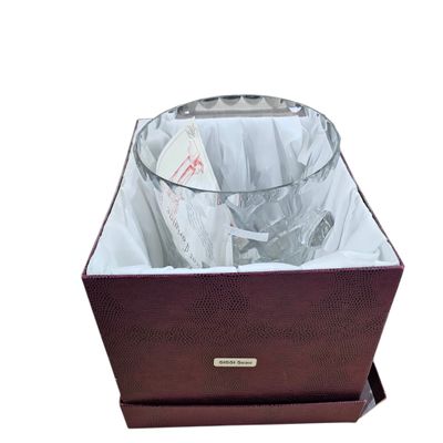 a wine glass in a wine glass holder on a white background
