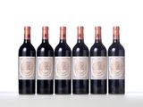 six bottles of red wine lined up in a row on a table