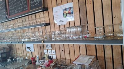 many glasses on the shelves in the store
