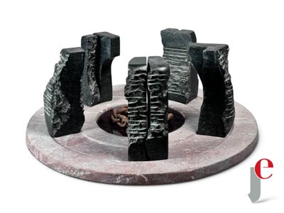 a sculpture of a group of rocks sitting on a table