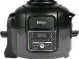 an image of a black and silver electric pressure cooker on a white background