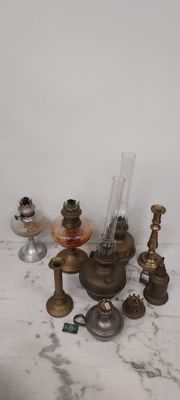 many different types of glass and brass items on the table