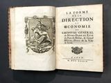 un vieux livre sur lequel figure l'image d'une femme assise sur un banc