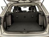 a trunk of a car with the back seats folded down