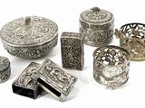an image of a group of silver objects on a white surface