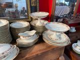 a lot of plates and bowls on a table