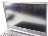 a silver laptop computer sitting on top of a table