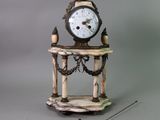 a clock that is sitting on top of a table