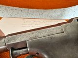 a gun that is sitting on top of a table