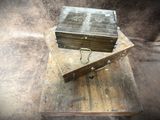 two old wooden boxes sitting on top of each other
