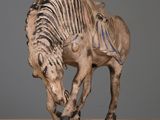sculpture of a horse with a skeleton on its back