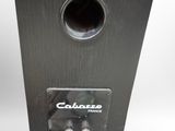 an image of a close up of a speaker on a white surface