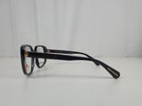 a close up of a pair of glasses on a white surface