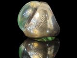 a silver ring with a green stone inside of it