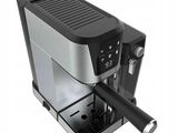 an image of a black and silver coffee machine on a white background