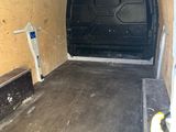 a van that is parked inside of a building