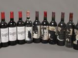 several bottles of wine are lined up in a row