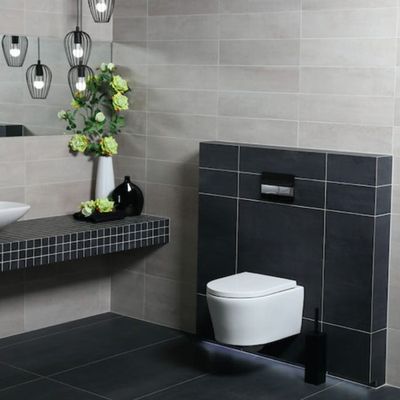 a bathroom with a toilet, sink, and mirror in it